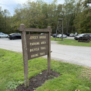Wooden park sign indicating the area’s attractions