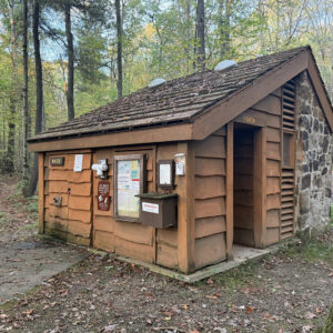 Small building in woods housing restrooms
